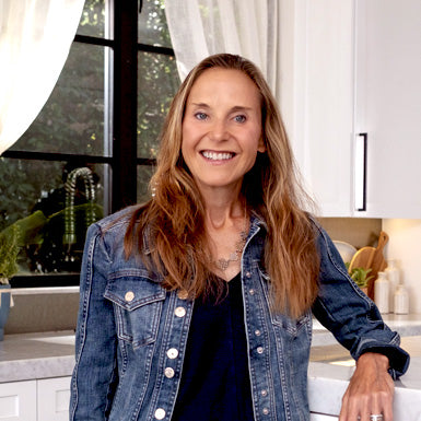 Rebecca Frechette Rudisch, co-founder of Yummers, standing in a kitchen