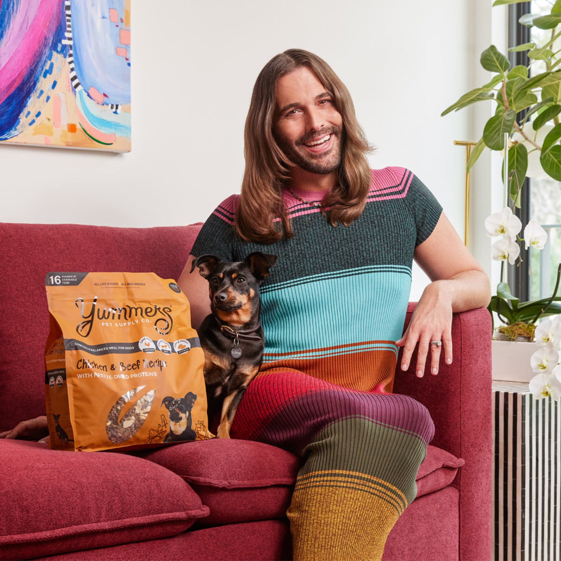 JVN with food and dog on couch